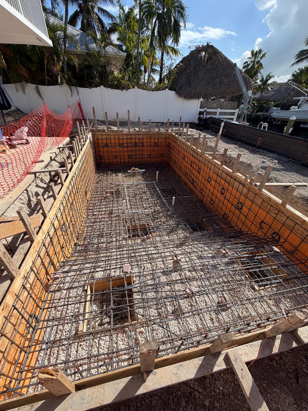 Waterfront pool shell construction with structural framing in South Florida